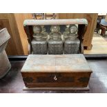 An oak cased three decanter tantalus,