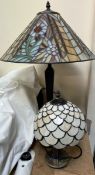 A Tiffany style table lamp decorated with flowers and leaves together with a small example