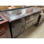 A 20th century mahogany sideboard with cupboards and drawers on cabriole legs