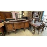 A mahogany extending dining table with pie crust edge on leaf carved cabriole legs and claw and