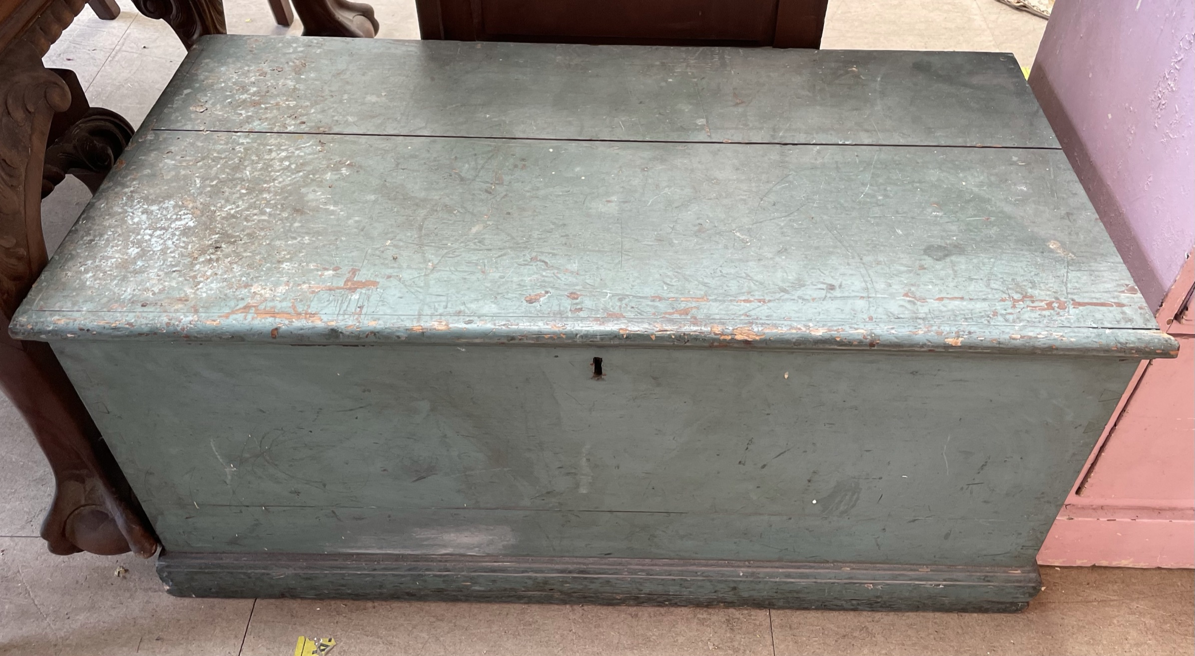 A green painted pine coffer on a plinth base