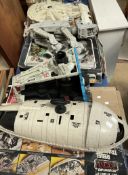 Four Star Wars boxed toys including a Rebel transport, Star destroyer, Millennium falcon,