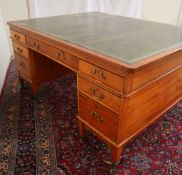 A late 19th century mahogany partners desk with a leather inset top above three drawers to either