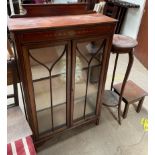 An Edwardian mahogany display cabinet together with a mahogany torchere and an oak table