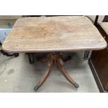 A 19th century mahogany supper table with a rectangular top on a baluster column and four splayed