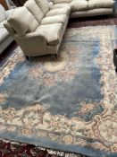 A Chinese blue ground rug,