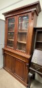A Victorian mahogany bookcase, with a moulded cornice above a pair of glazed doors,