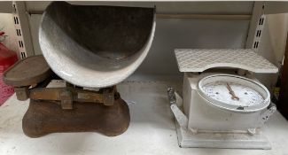 A white painted weighing scales together with a shop scales