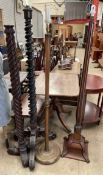 A mahogany standard lamp with a twisted column together with three other standard lamps