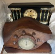 A cut down Aeroplane propeller mounted with a clock with a silvered dial and Arabic numerals