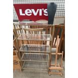A Levi's advertising sign together with a shelf unit, an easel,
