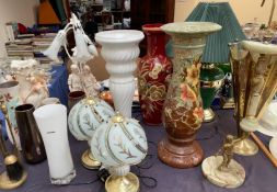 A floral painted jardiniere stand together with a collection of table lamps, pottery vases,