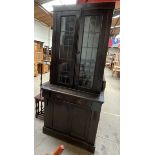 A bureau bookcase with a pair of leaded glass doors,