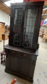 A bureau bookcase with a pair of leaded glass doors,