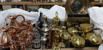 A collection of copper measuring jugs, together with a stainless steel part tea set, brass kettles,