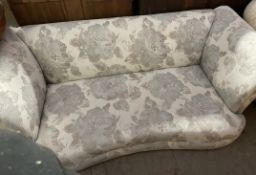 An upholstered two seater settee