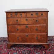 An 18th century walnut chest,