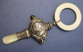 A George V silver and mother of pearl baby's rattle, with a white plastic teething ring,