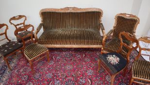 A Biedermeier style salon suite comprising a three seater settee,