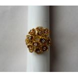 An 18ct yellow gold diamond cluster ring set with twelve round brilliant cut diamonds, size K 1/2,