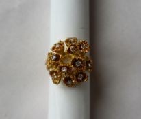 An 18ct yellow gold diamond cluster ring set with twelve round brilliant cut diamonds, size K 1/2,