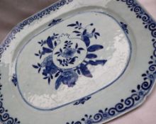 A Chinese porcelain meat plate, decorated in underglaze blue with flowers.