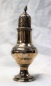 A George III silver caster, with a flame finial,