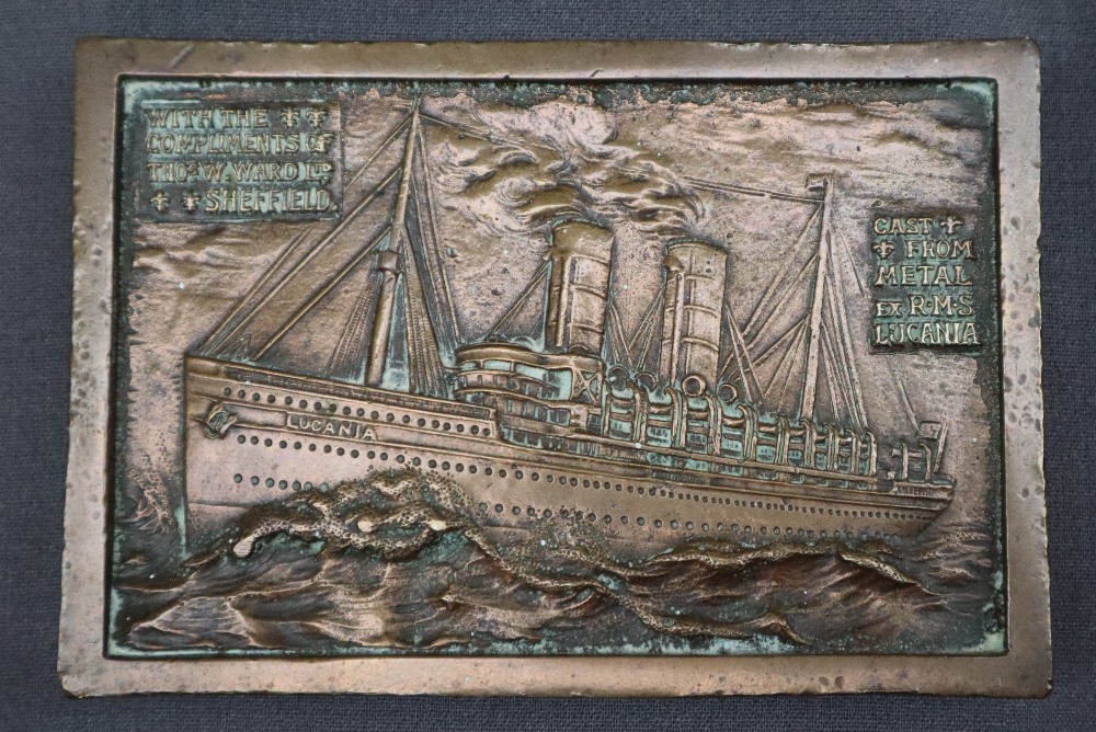 A bronze plaque / paperweight cast with an image of the RMS Lucania, "cast from metal from the ship,