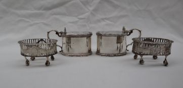 A pair of George V silver mustard pots and covers,