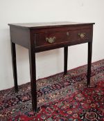 An 18th century oak lowboy, with a rectangular top above a single drawer and square legs,