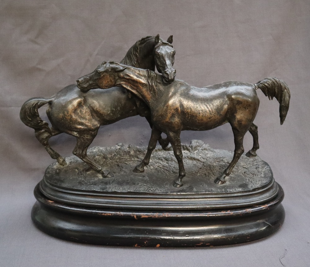 After P J Mene Two horses Spelter On an oval baser Bears a signature 56cm long x 25cm wide x 41cm