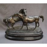After P J Mene Two horses Spelter On an oval baser Bears a signature 56cm long x 25cm wide x 41cm