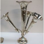 A George V silver epergne, with a central trumpet and three removable trumpets on a circular base,