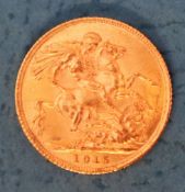 A George V gold sovereign,