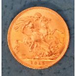 A George V gold sovereign,