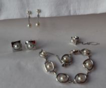 A silver bracelet set with pearls, together with a pair of silver and pearl set cufflinks,