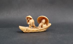 A late 19th / early 20th century netsuke in the form of two figures in a boat, signed to the base,