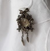 A marcasite brooch watch, in the form of a cuckoo clock,