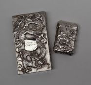 A Chinese silver card carrying case, the one side decorated with dragons, the other with bamboo,
