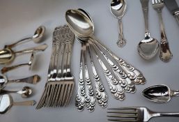 A set of six Danish silver table spoons, with foliate scrolling handles,