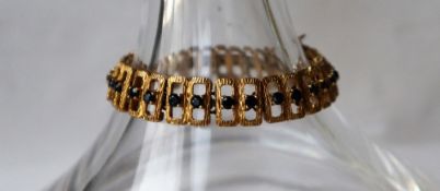 A 9ct gold and sapphire set bracelet, with open rectangular links, 18.5cm long, approximately 26.