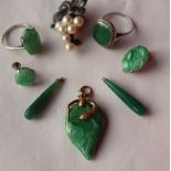 A jade pendant of pear shape,