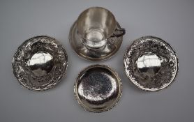 A pair of Chinese silver bon bon dishes of circular form, pierced with dragons amongst clouds,