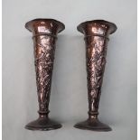 A pair of Art Nouveau silver bud vases, with a flared rim,