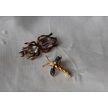 An 18ct yellow gold sapphire and diamond insect pendant set with two pointed oval sapphire wings