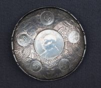 A Chinese white metal coin pin tray, inset with six Chinese coins,