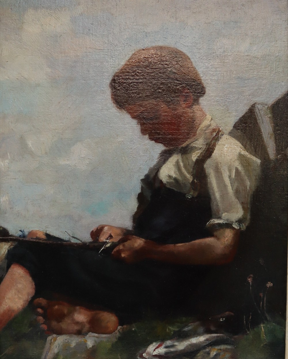 19th Century Continental School A young boy gutting fish Oil on canvas 39.