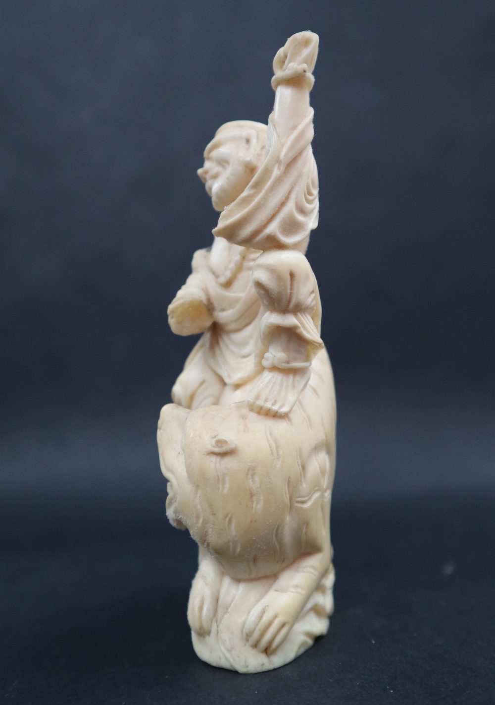 A simulated ivory figure group of a figure riding a tiger, 11cm high, - Image 6 of 7