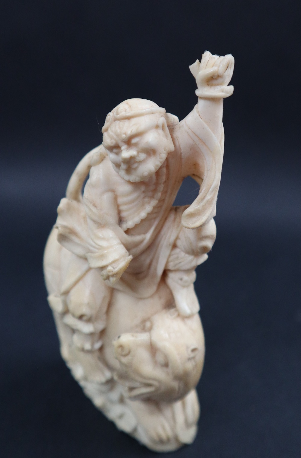 A simulated ivory figure group of a figure riding a tiger, 11cm high, - Image 7 of 7