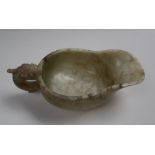 A Chinese marbled white jade jug, of archaic form,
